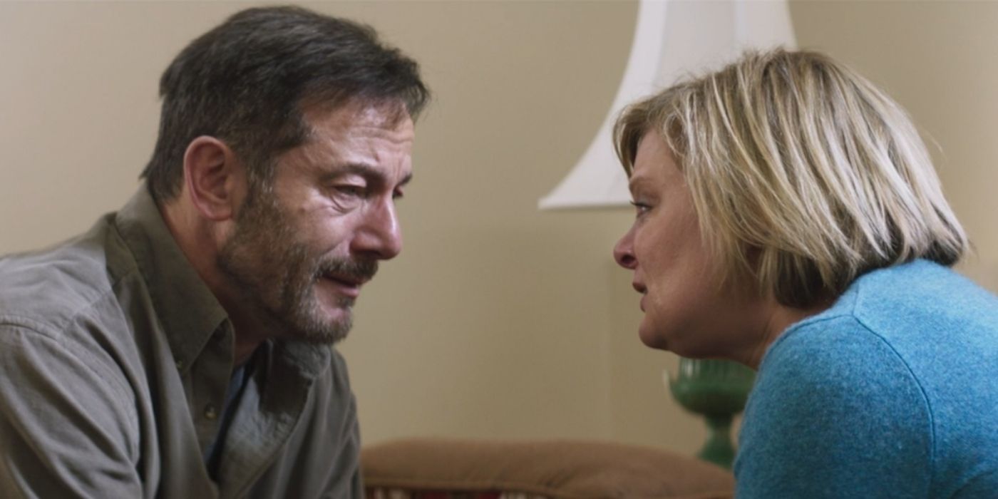 Jason Isaacs and Martha Plimpton face to face during as scene from 2021&rsquo;s Mass
