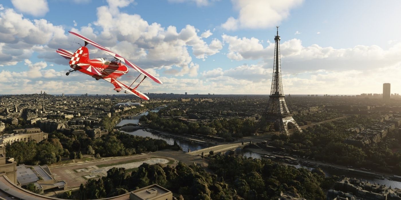 A small airplane overflying Paris with the Eiffel Tower in the background