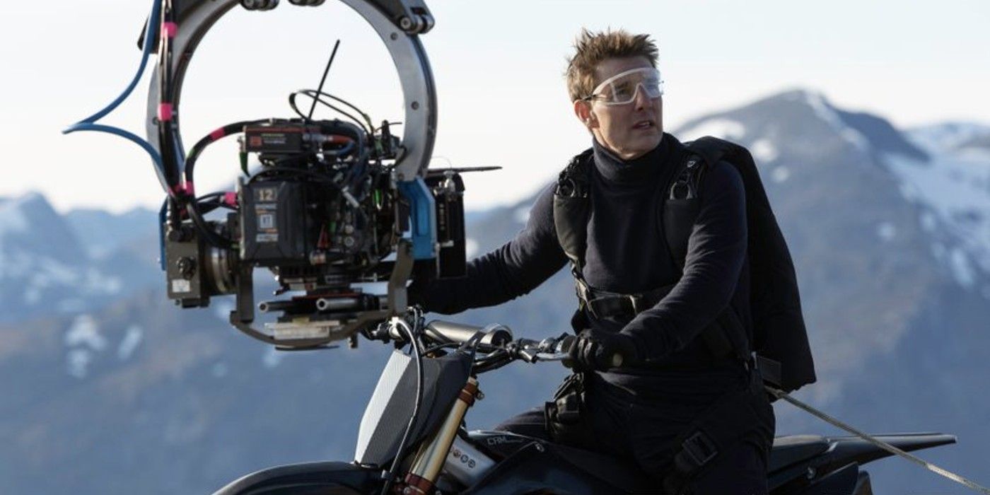 Tom Cruise sits on a motorcycle in Mission Impossible 7