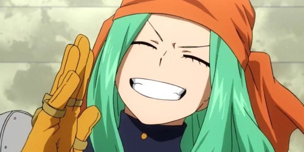 Ms Joke from My Hero Academia grinning with her eyes closed and hand to her face