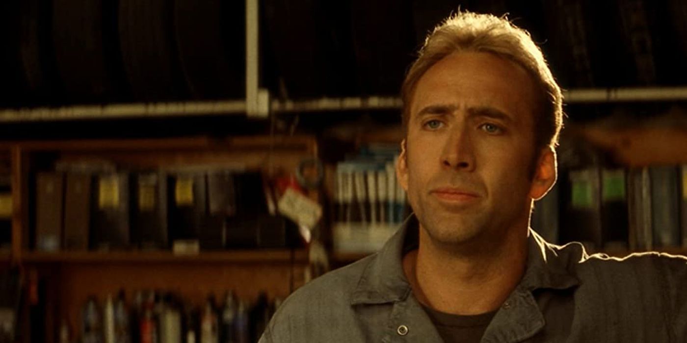 NIc Cage standing in the garage in Gone in 60 Seconds.