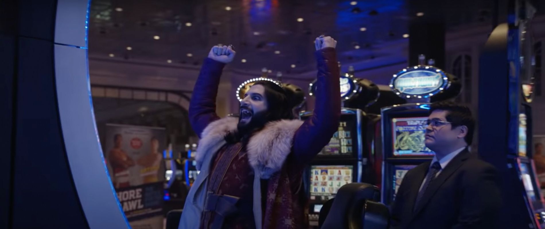 Nandor playing a slot machine in What We Do in the Shadows