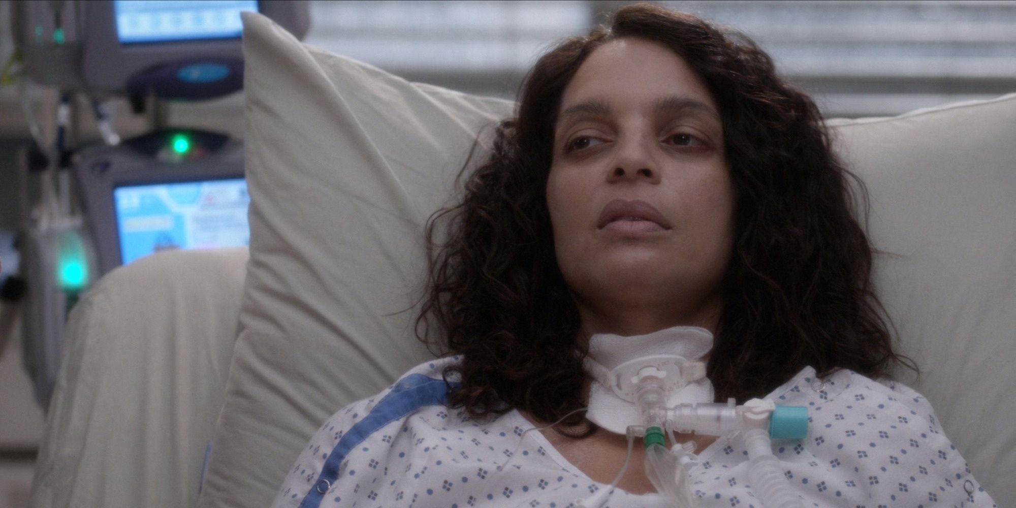 Natasha looking pale but awake in the hospital bed in Greys Anatomy.