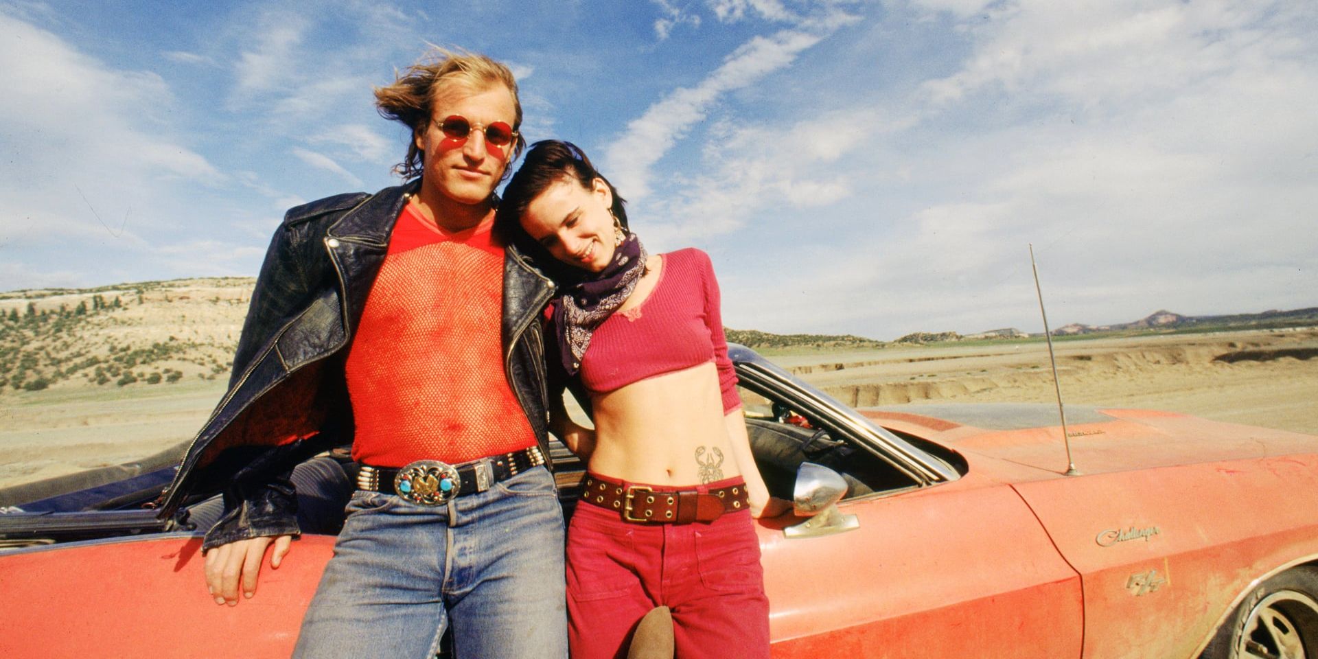 Mickey and Mallory sitting against a car in Natural Born Killers.