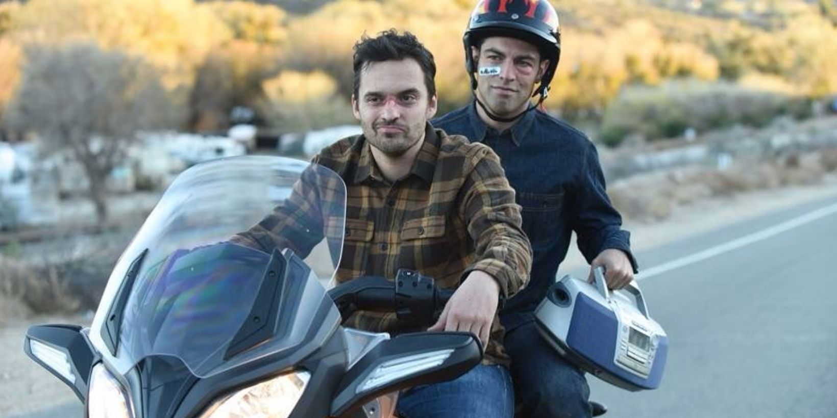 Nick and Schmidt ride on a motorcycle together in New Girl