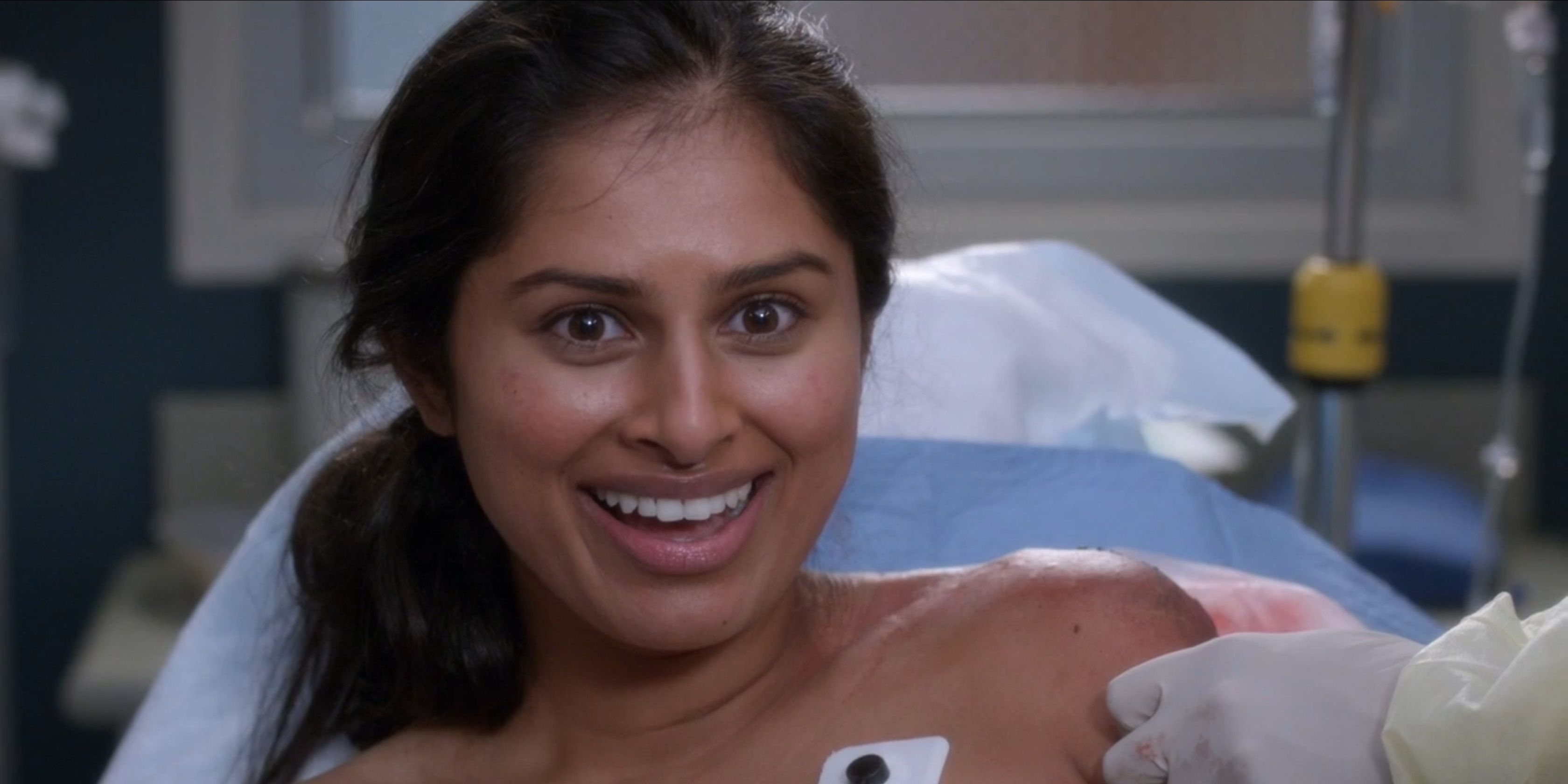 Image of Nisha smiling under the influence of drugs in the hospital bed in Greys Anatomy.