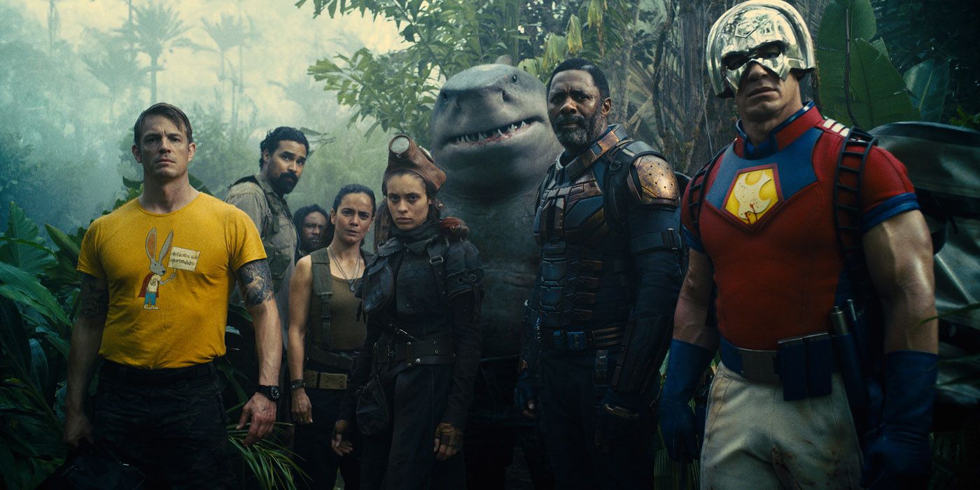The Suicide Squad looking at something while in a jungle on their mission.