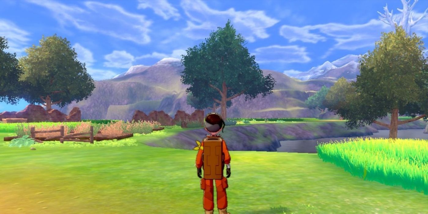 Victor looking at Ballimere Lake during the daytime in Pokémon: Sword &amp; Shield.