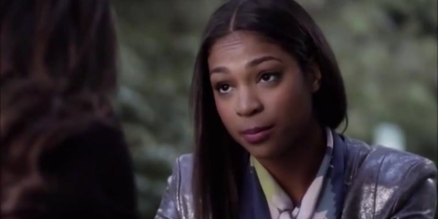 Shana looking serious while talking to someone in Pretty Little Liars