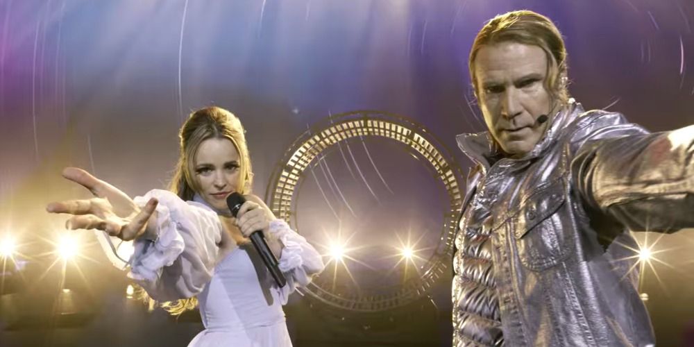 Rachel McAdams and Will Ferrell in Eurovision Song Contest The Story of Fire Saga singing and holding their hands towards the camera