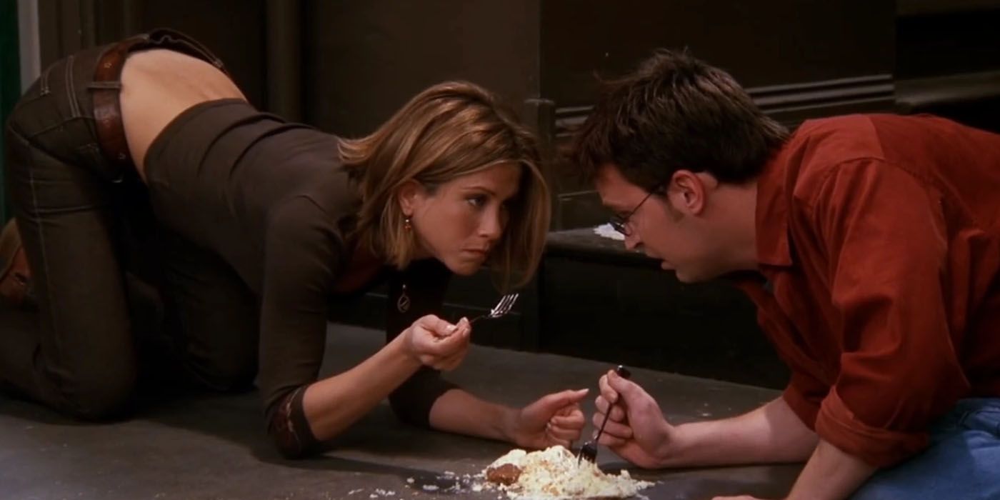 Rachel and Chandler eat cheesecake on the floor in Friends