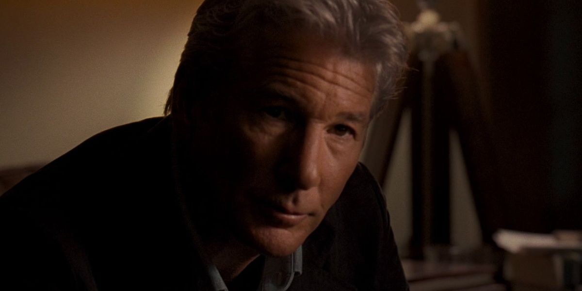 Richard Gere sitting in the dark in The Double