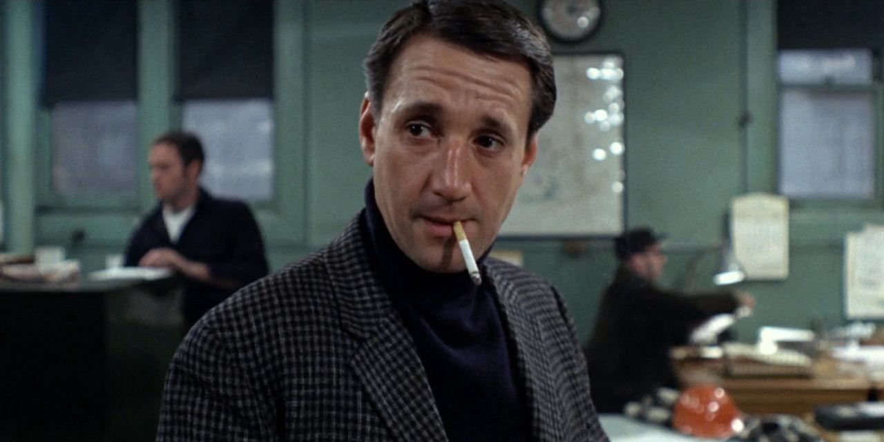 Roy Scheider smoking a cigarette in The French Connection