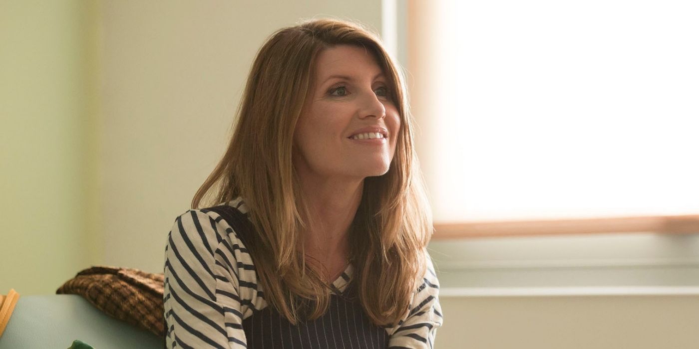 Sharon Horgan smiling sitting on a chair in Catastrophe