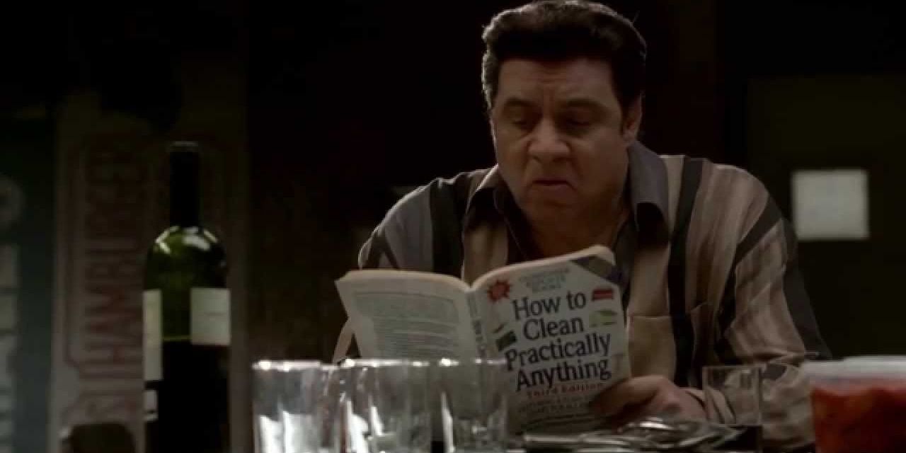 Silvio in the back room of the Bada Bing as he reads a book about cleaning in The Sopranos