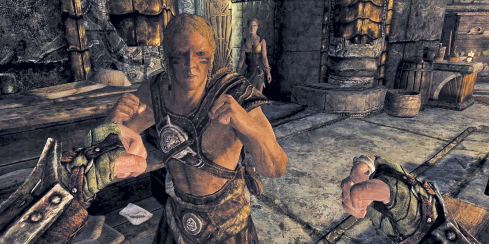 First person view of raised fists towards skyrim characters whose fists are also raised in direction of player with a stone room in background  and various crates and barrels