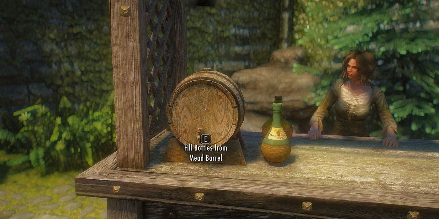 A shop owner standing near a mead barrel in Skyrim