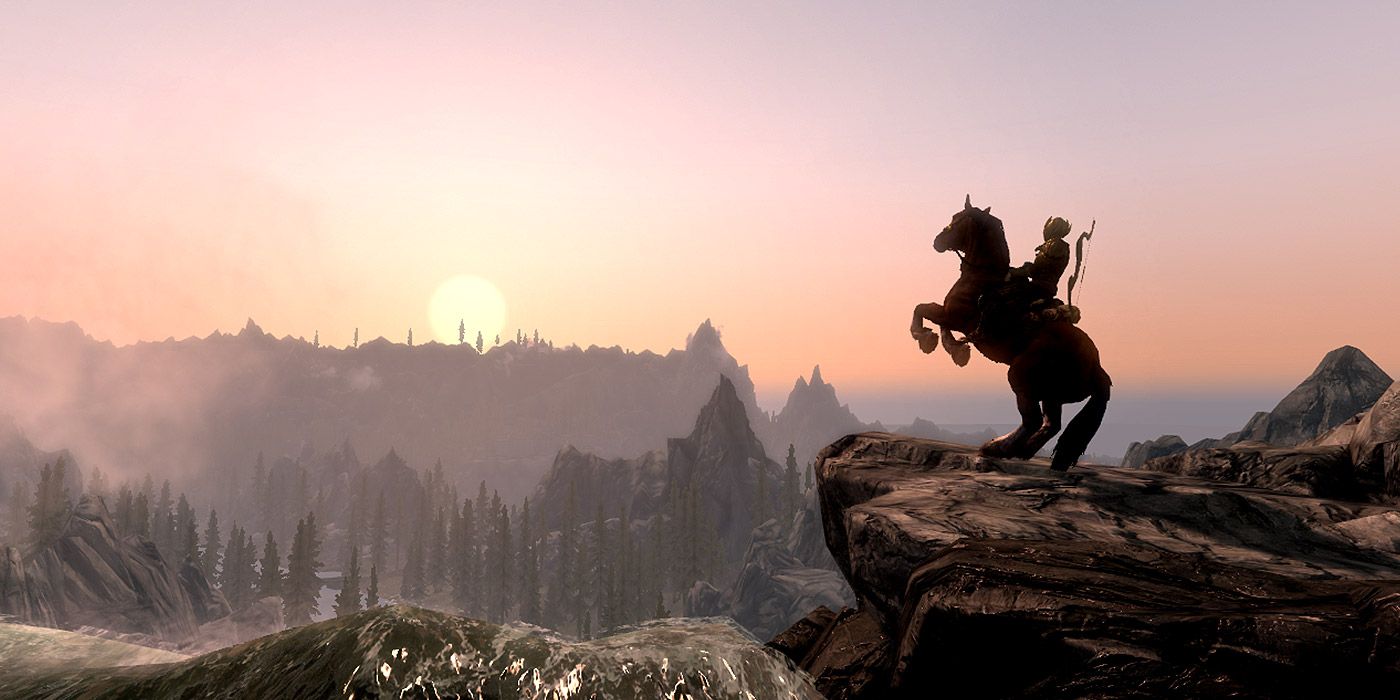 A warrior on horseback looking over a valley in Falskaar, from Skyrim
