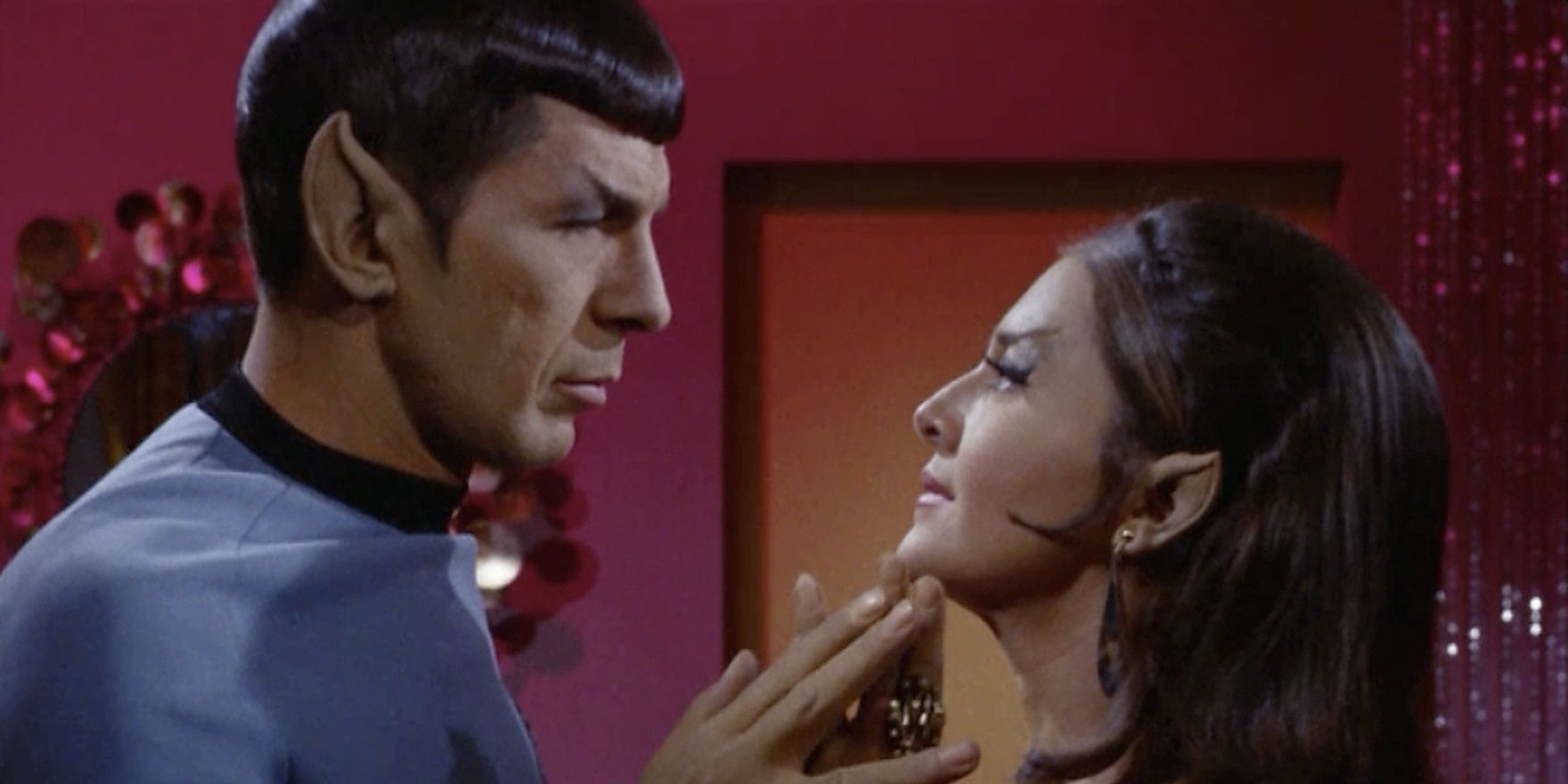 Spock and the Romulan commander touch hands in Star Trek TOS