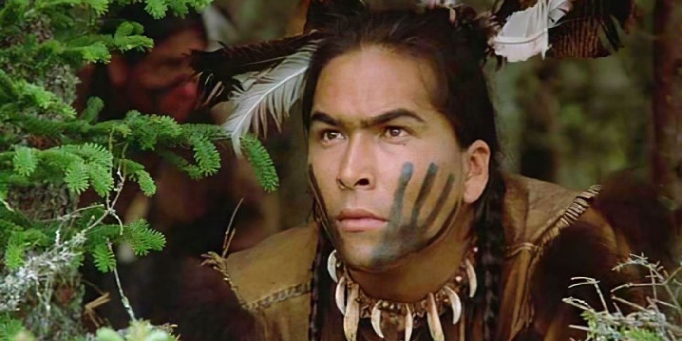 Squanto lurking behind trees in Squanto: A Warrior's Journey