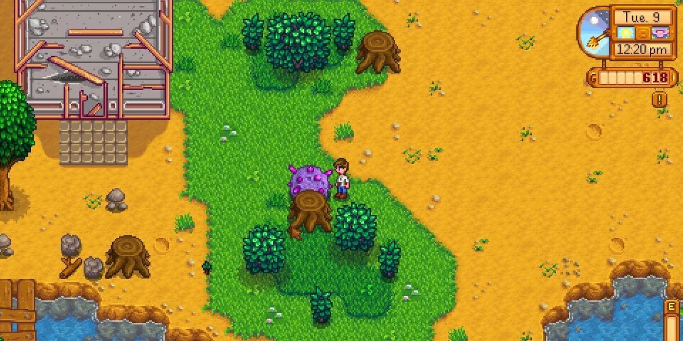 A villager stands besides a meteor in Stardew Valley.