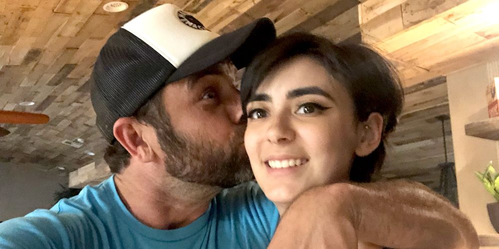 JT Lavin kisses his wife Roxanne on the cheek