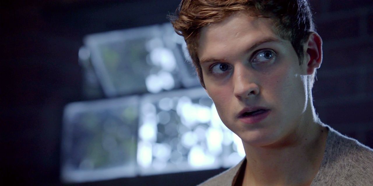 Isaac Lahey from Teen Wolf in a dark room
