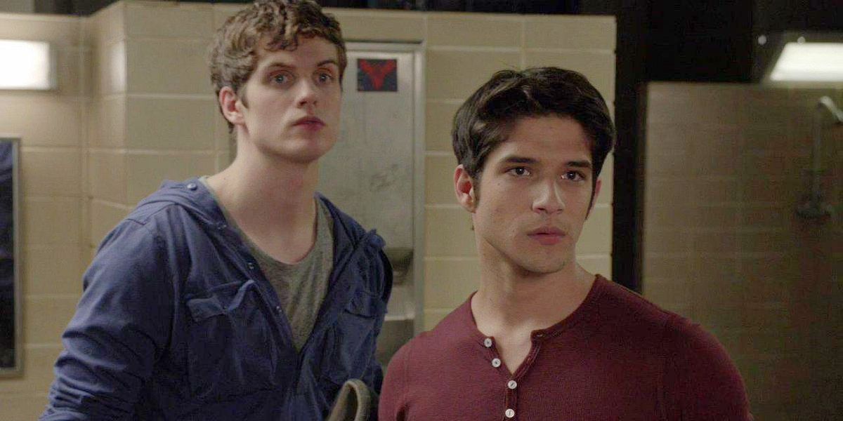 Isaac stands behind Scott in the locker rooms in Teen Wolf