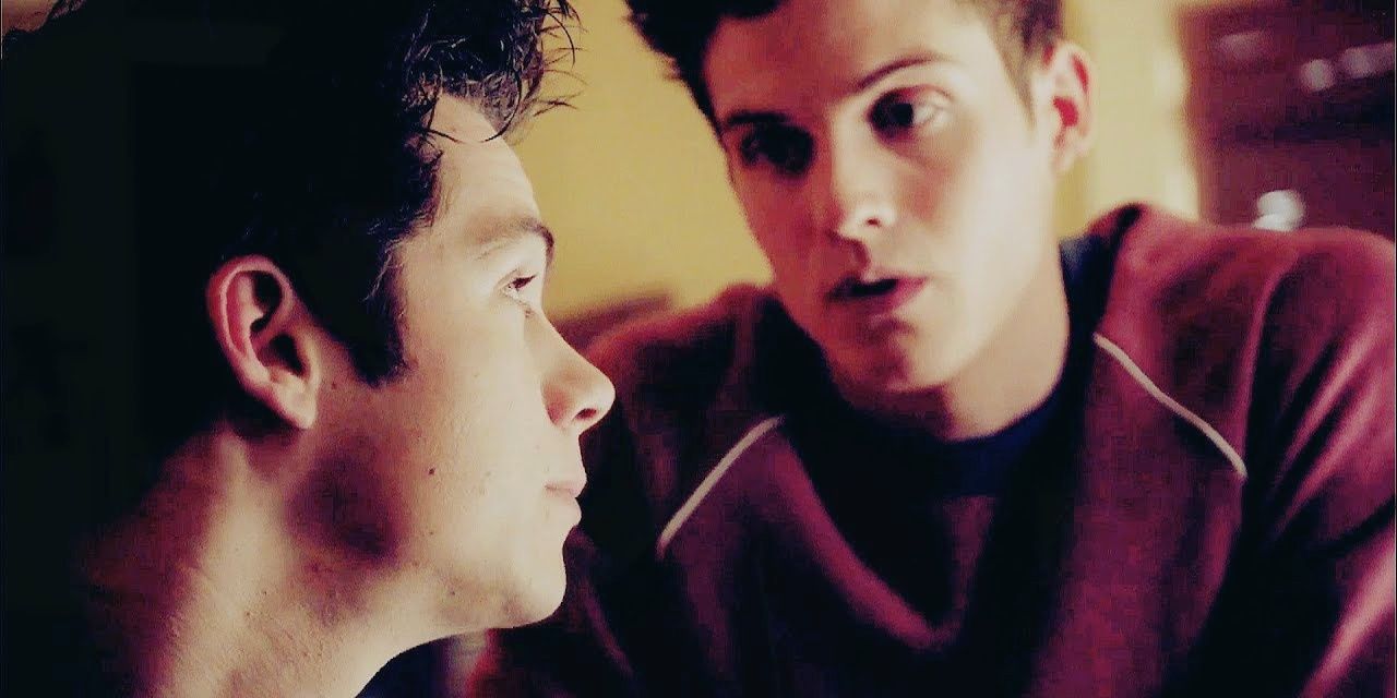 Stiles looks up at Isaac who is wearing his lacrosse gear in Teen Wolf