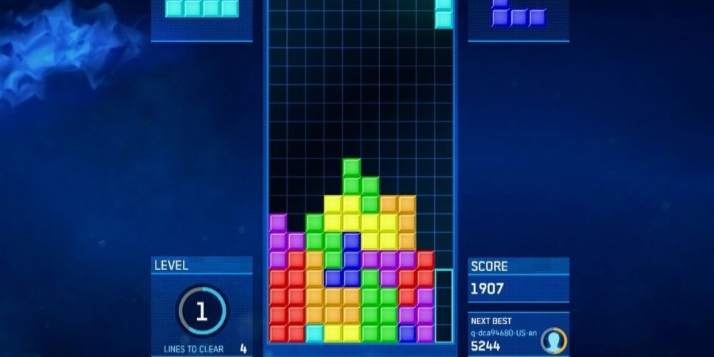 A screenshot of classic Tetris gameplay on a blue background