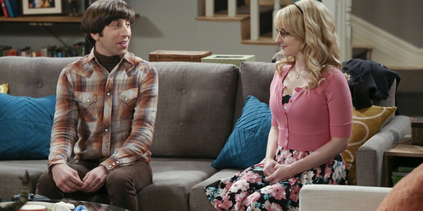Howward and Bernadette talking on their couch in The Big Bang Theory