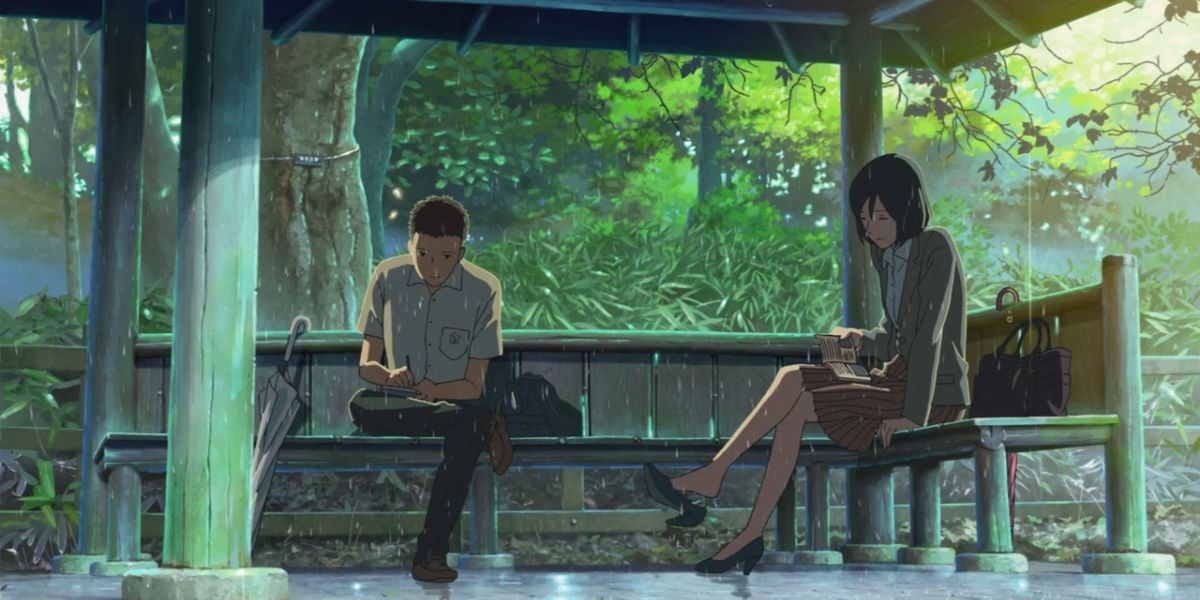 Two characters sit in a gazebo in Garden of Words.
