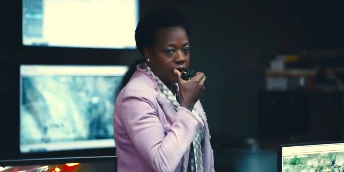 Amanda Waller giving orders to the Suicide Squad from her control room.
