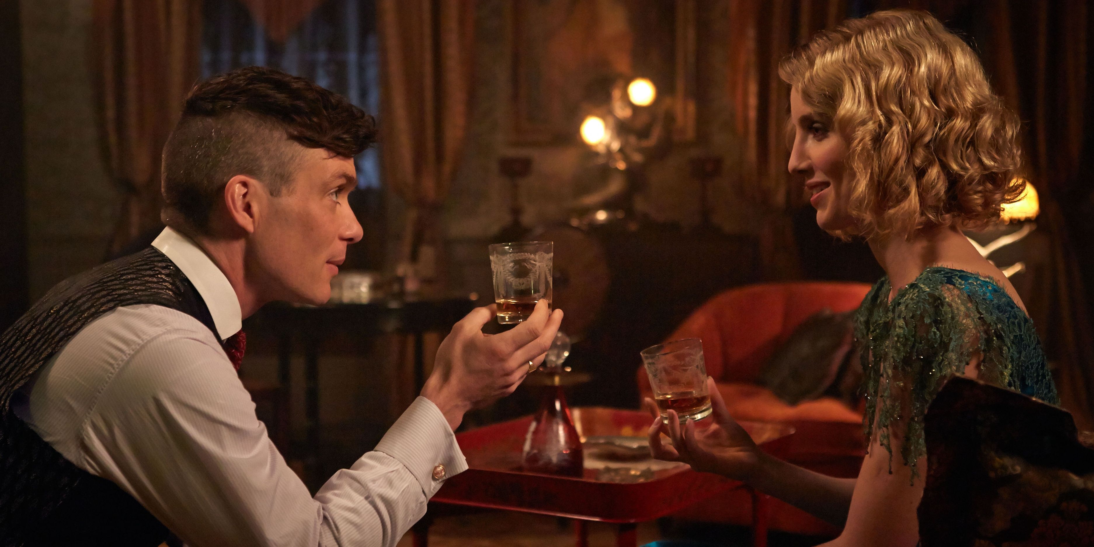Grace shares a drink with Tommy inside her apartment in Peaky Blinders