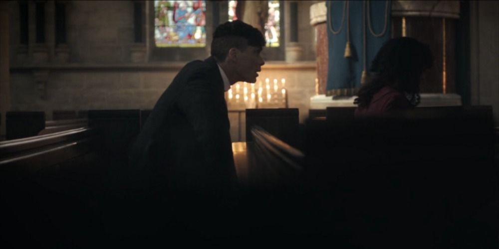 Polly prays as she advises Tommy not to keep the government guns in the Peaky Blinders pilot