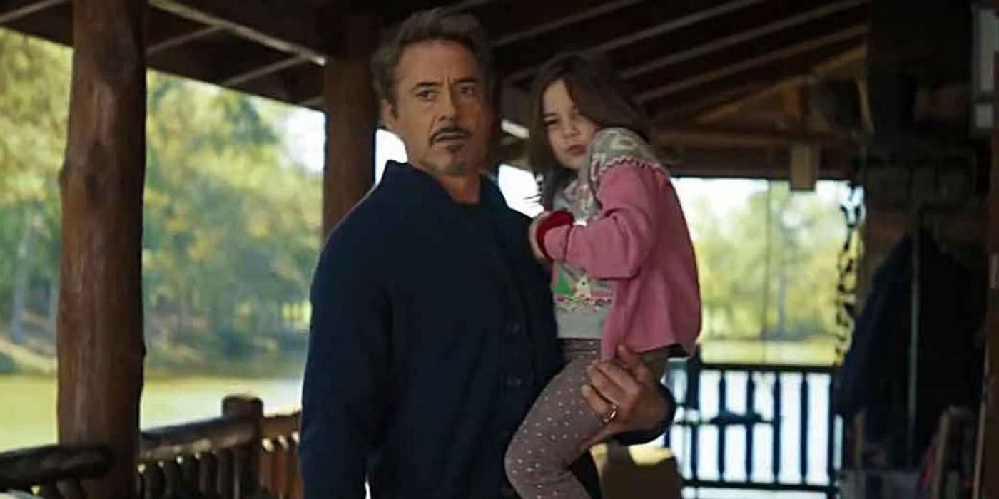 Tony Stark holding his daughter in Avengers Endgame.