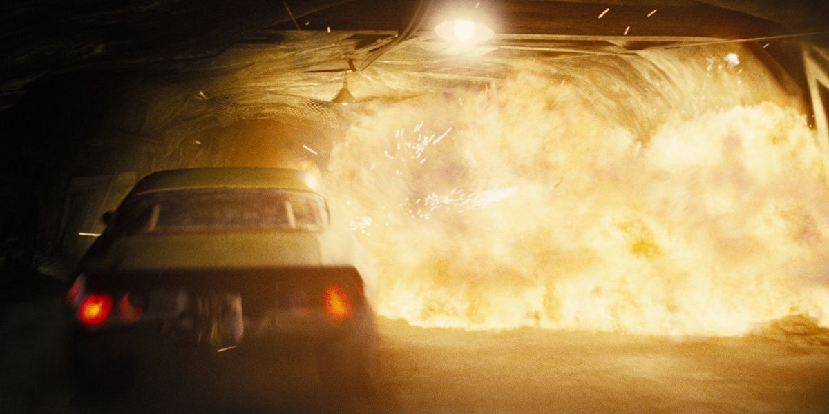 Dom drives away from an explosion in a tunnel in Fast and Furious