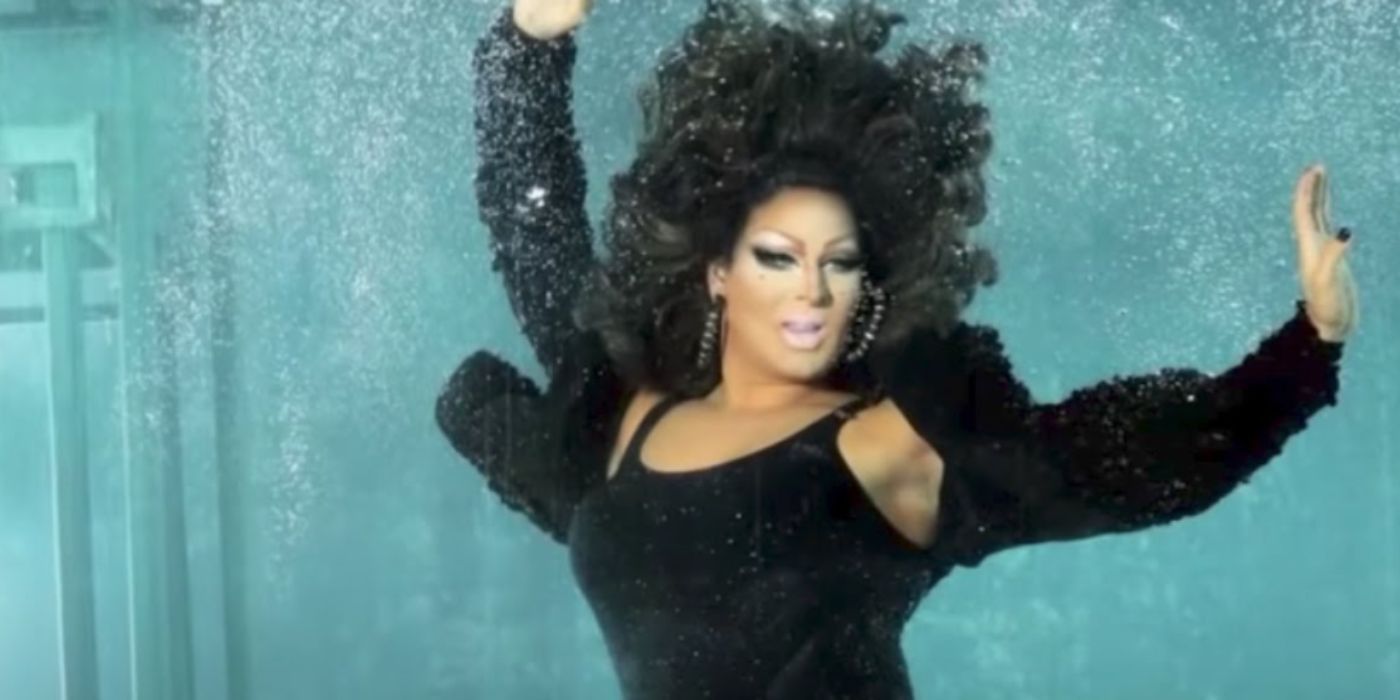 An image of Coco Montrese posing underwater in RuPaul's Drag Race