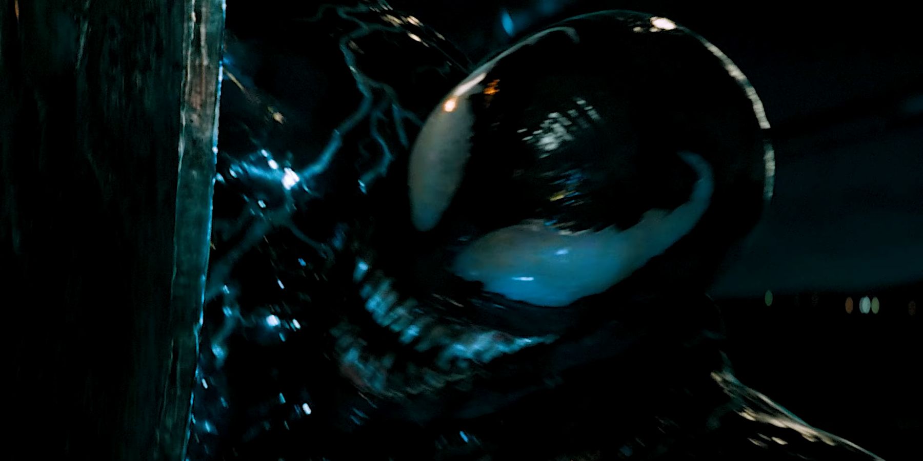 Venom being startled by Riot's scythe in Venom