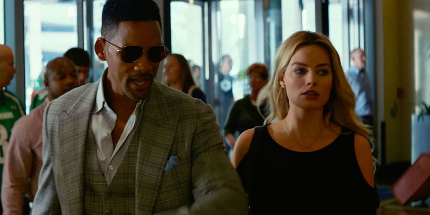 Will Smith walking with Margot Robbie in terminal in Focus.
