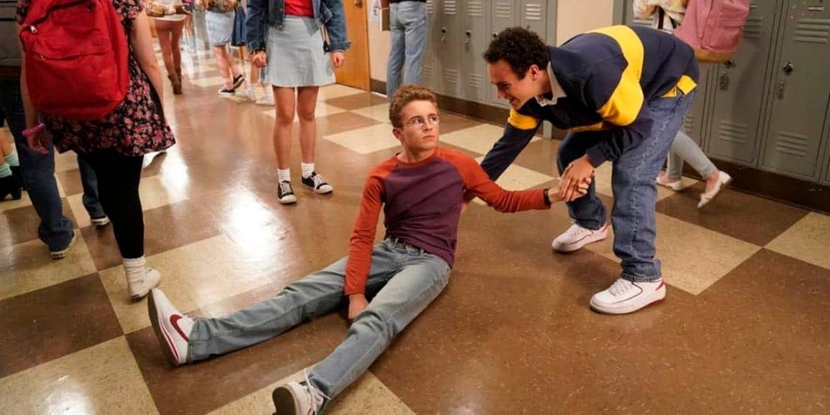 The Goldbergs: Barry helping Adam up after he knocked him down in the hallway