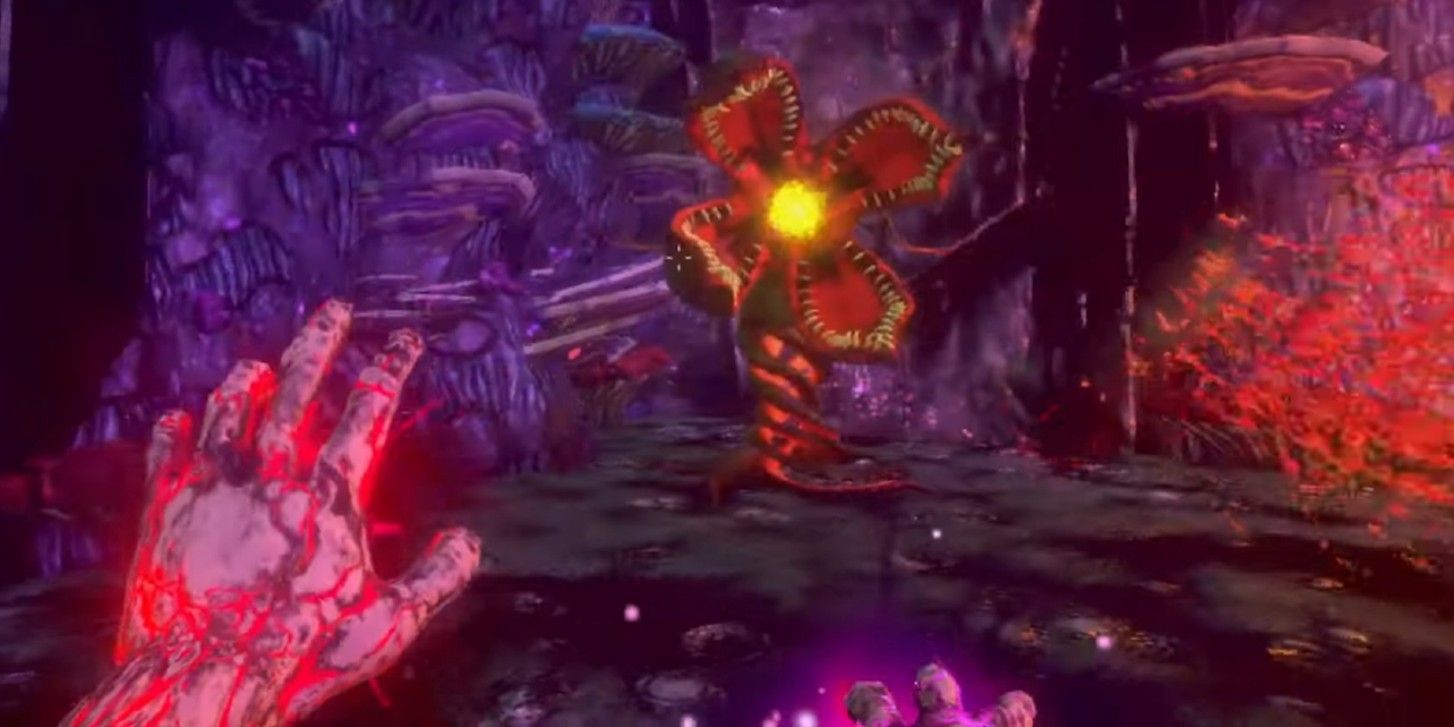A glowing hand reaching out towards a flower-like monster in the trailer for the game, Into the Pit