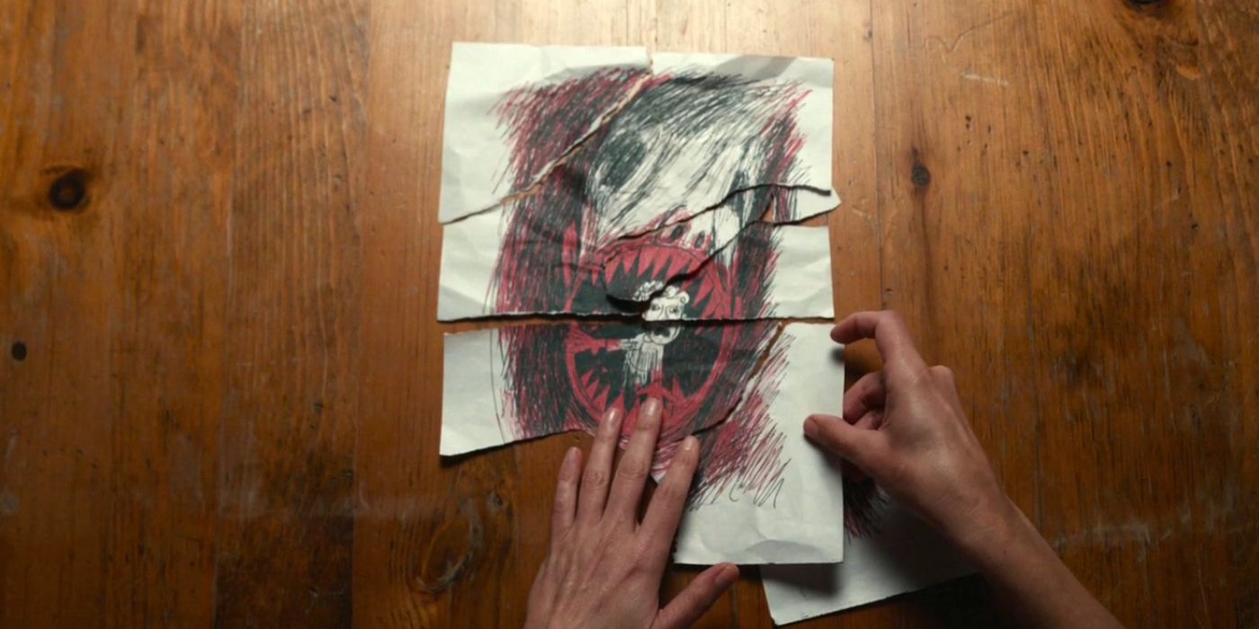 Antlers movie showing a drawing on a table