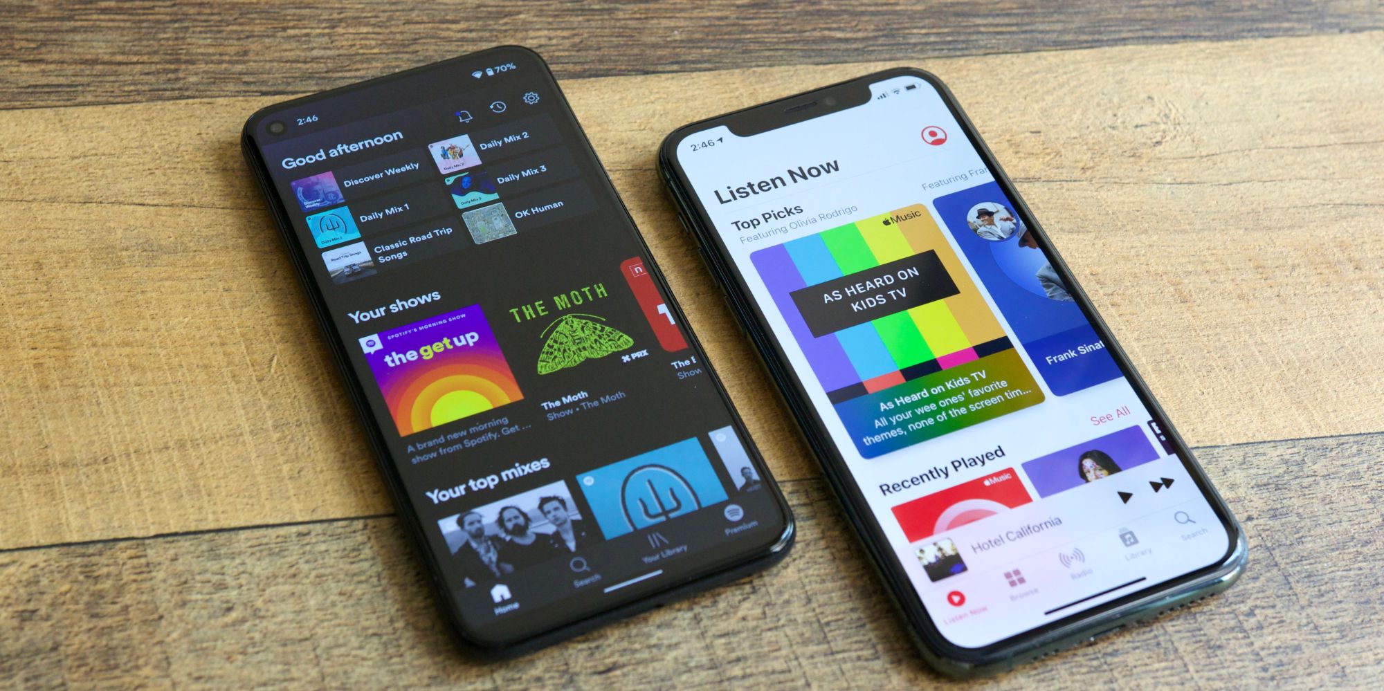 Apple Music and Spotify apps running next to each other