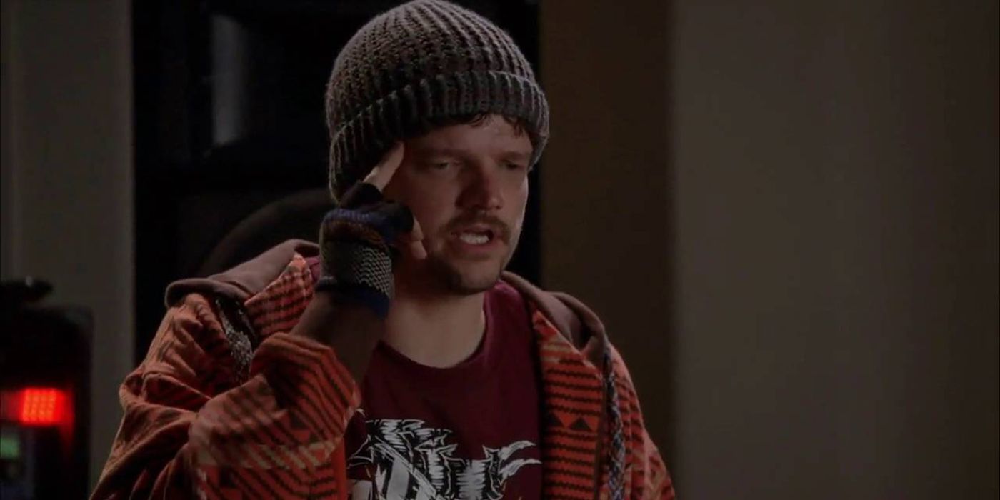 Badger with his finger to his temple and a beanie on his head on Breaking Bad.