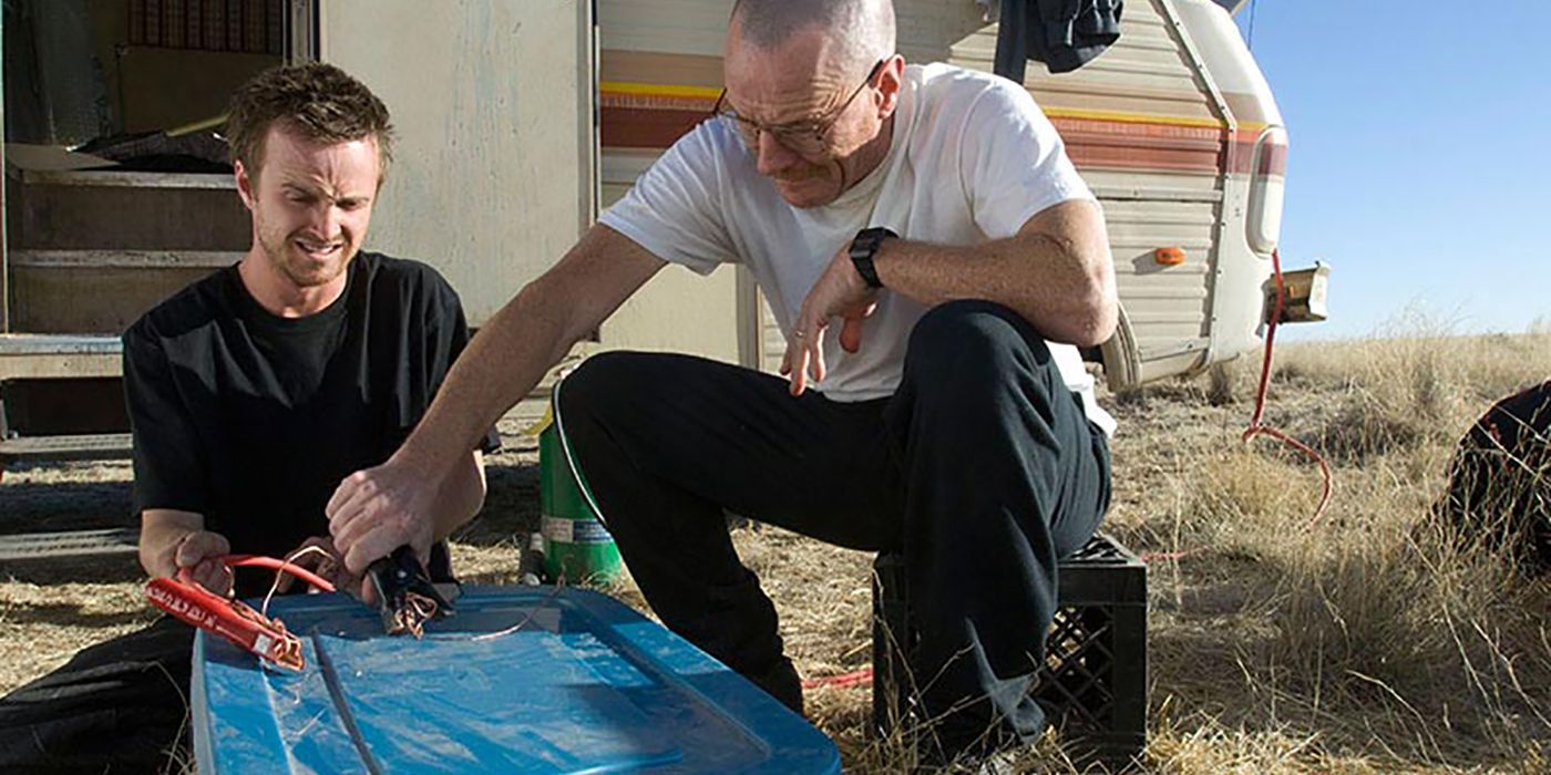 Walt and Jesse trying to build something by the RV in the desert on Breaking Bad.