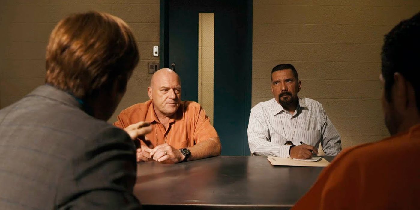 Saul and Hank sitting down together in the interrogation room on Breaking Bad.