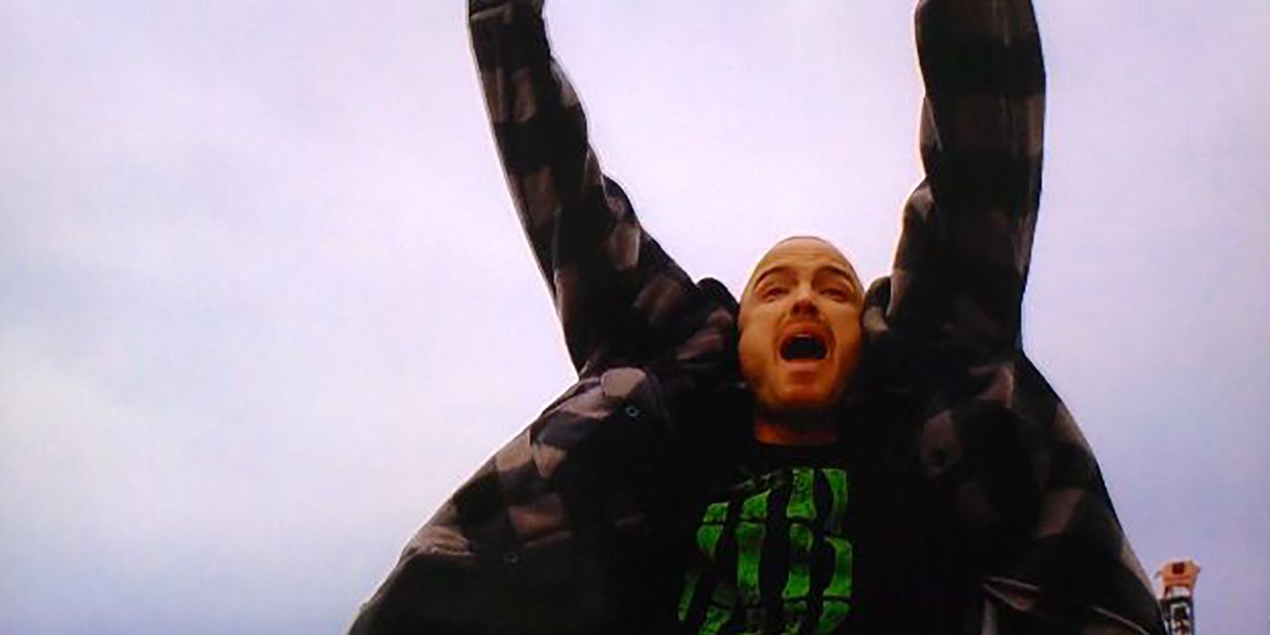 Jesse throwing his hands in the air, his mouth open yelling from a scene in Breaking Bad.