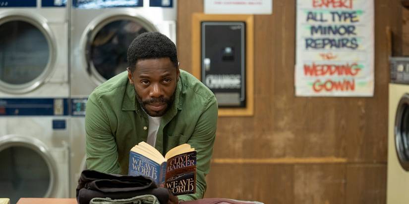 Burke (Colman Domingo) reading in Candyman 2021