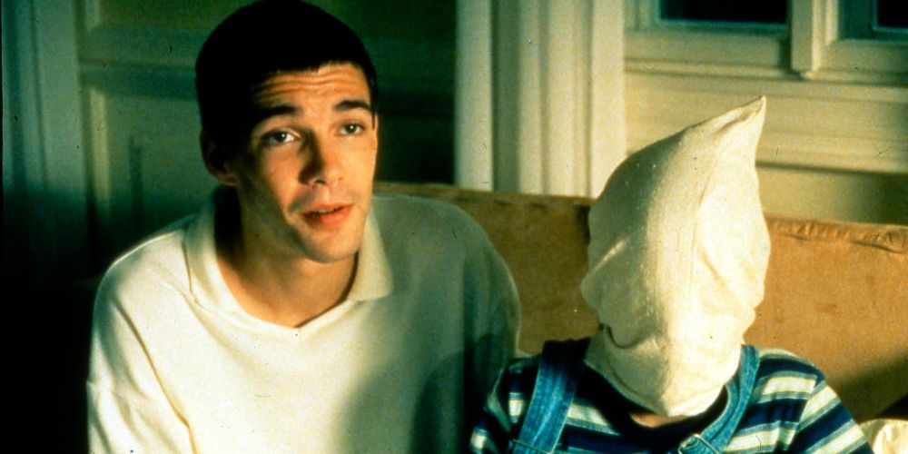 Paul places bag over Schorschi's face in Funny Games